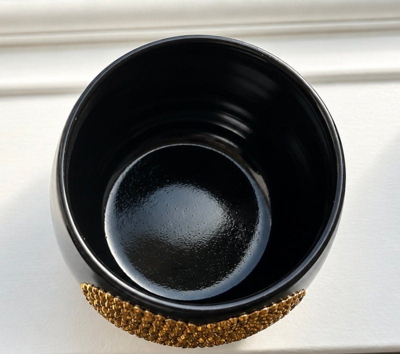 Top view of The Golden Child black ceramic planter showing the planting opening