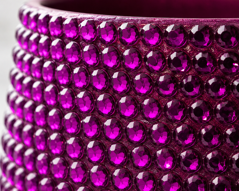 Magenta fuchsia decorative ceramic plant pot shown in close-up with sparkling magenta crystal detailing
